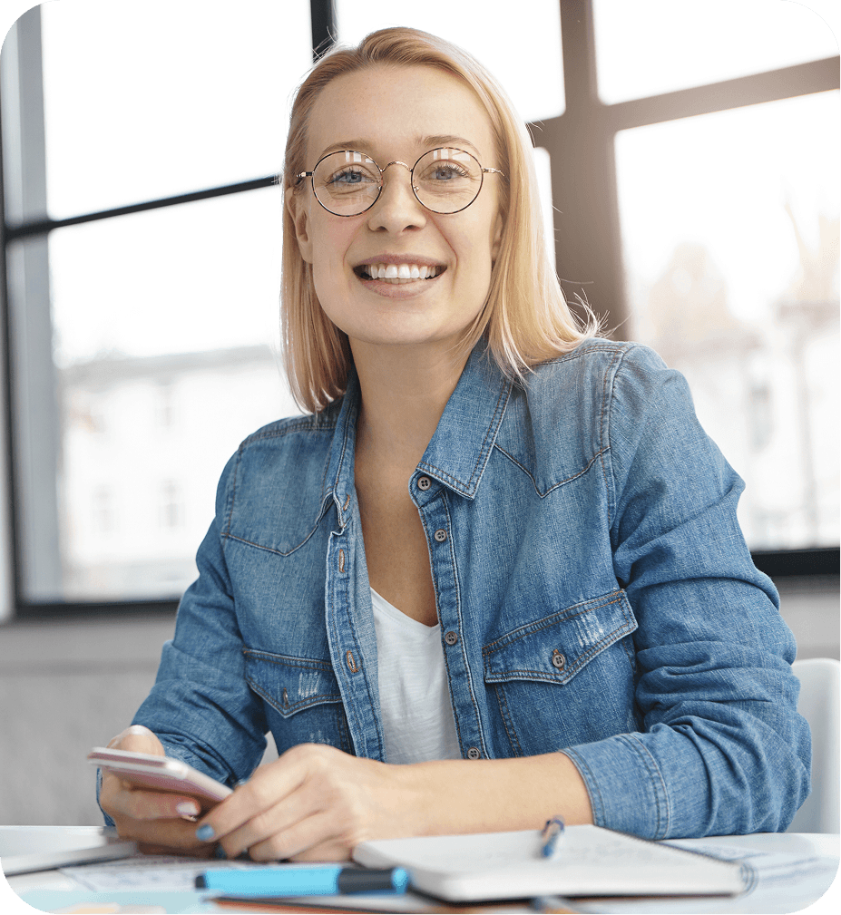 Professional woman smiling while seated at a desk